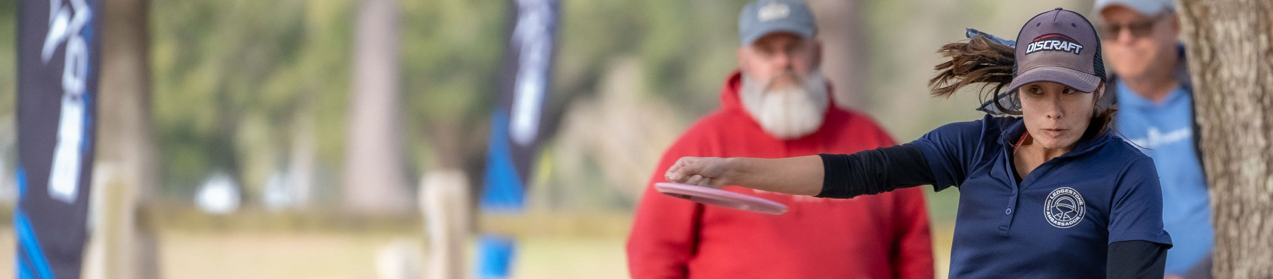 Woman throwing a golf disc